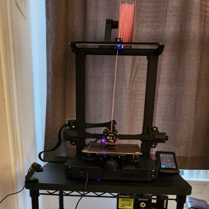 my 3D printer on a black cart